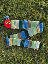 Handmade Very Hungry Caterpillar Scarf!🐛 Pattern by @yagianunu on IG Size: ~60 inches long, 4.5 inches wide Due to high demand and the made to order nature, this item has a production time of around 1-3 weeks, then is shipped right after! Thank you in advance for your patience as all of the scarfs are made to order! Since the scarf handmade, it may slightly differ from the pictures. Made with acrylic yarn! Hand washing is recommended.  Please reach out if you have any questions or concerns! :)