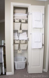 Guest room closet- like the idea of a laundry basket in there for guests to put their dirty linens in and towel bars on the inside of the door