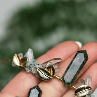 Fawn & Sparrow Crystal Crowns on Instagram: "Moss Agate collection for the entire bridal party! Tiara, pocket boutonniere, and hair stick coordinate in this magical woodland fairy look 🍃💕 #mossagate #fairywedding #crystalwedding #mossagatejewelry #weddinghair #bridesmaidshair #pocketboutonniere"