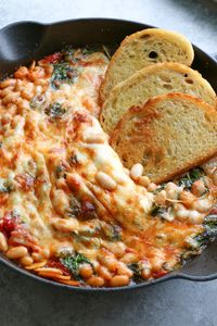 Cheesy White Bean Tomato Bake recipe from NY Times Cooking. I made some modifications and have to share this recipe! It's so delicious and quite addicting!