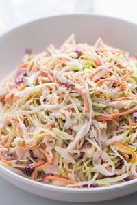 Easy homemade coleslaw with a simple dressing. This coleslaw is creamy, sweet, and tangy at the same time. This is a classic coleslaw recipe, perfect for any occasion! #coleslaw