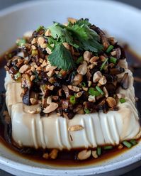 One of the best silken tofu recipes! Steamed tofu topped with mushrooms, roasted peanuts and soy sauce. Easy and delicious!