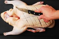 poking the duck's skin with a knife (how to cook duck - step-by-step photos)