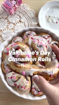 This cinnamon roll recipe is perfect for Valentine’s Day – absolutely delicious and easy to make! These heart shaped cinnamon buns are coated in frosting and covered in festive sprinkles for a sweet treat that everyone loves!