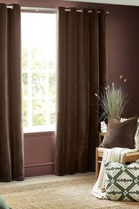 The Heavy Chenille eyelet curtains feature soft, luxurious chenille velvet in muted earth tones with a serene, modern washed look, perfect for neutral contemporary spaces.