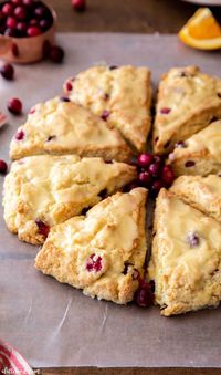 These Homemade Cranberry Orange Scones with fresh orange glaze is such a perfect Christmas breakfast recipe. Making cream scones from scratch is very simple, and these scones are so moist and flavorful thanks to the sour cream, heavy cream and orange juice.