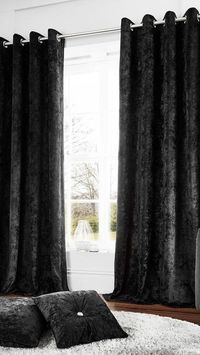 Give your home a touch of luxury with these lavish crushed velvet curtains in black.