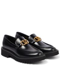 The classic penny loafer receives a luxurious update in the form of this Valentino Garavani design | Valentino Garavani VLogo leather loafers