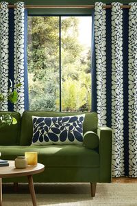 Brand-new Orla Kiely print of the Sycamore Stripe. The graphic shapes inspired by sycamore tree seeds adorn the timeless navy blue and cream colour scheme. Made with 100% cotton, these curtains showcase the iconic Linear Stem design in neutral cream on the lining.