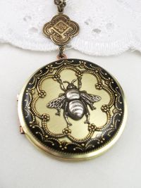 Vintage brass silver bee locket. 38mm brass bee locket. All lockets are made to order and will take a minimum of 5-7 days before dispatch. I have decorated the front of the locket and sealed the image with resin giving it a glass like finish. I have cleaned the back of the