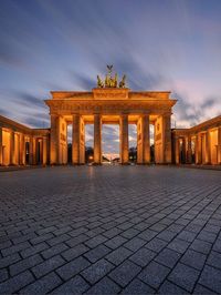 Brandenburg Gate is a historical landmark in Berlin, Germany, built in 1791. It features a classical design with three openings and columns. The gate witnessed significant historical events and symbolized the division of Germany. After German reunification in 1990, it became a symbol of unity and freedom, attracting tourists as a prominent attraction in the city.