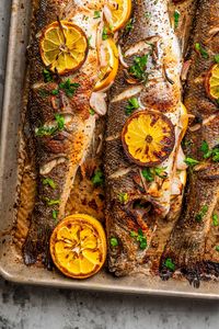 This roasted branzino recipe is a must-try. A whole branzino is seasoned with salt and pepper, stuffed with shallots and lemon slices, and roasted to flaky perfection. And it's all done in 20 minutes!