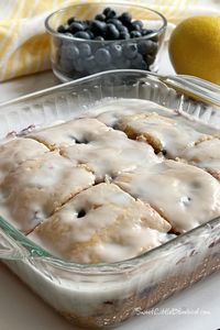 This photo shows the cake with lemon glaze on top, cut into nice equal pieces in the baking dish.