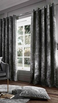 Bring your glam living room ideas to life with velvet curtains! We love these silver eyelet curtains by Catherine Lansfield.