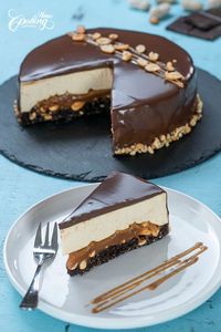 This amazing Snickers Mousse Cake is made of a chocolate peanut sponge cake at the bottom topped with an irresistible gooey salted caramel and peanut layer, covered in a silky flavorful peanut and cream cheese mousse and chocolate glaze.