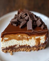 Learn to make a luscious Homemade No-Bake Twix Cheesecake with caramel, chocolate, and a graham cracker crust. Perfect easy dessert!