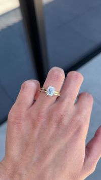 The Alice engagement ring is a stunning picture of symmetry. With an eye-catching 7.5×5.5 (1.25ct) Emerald Cut Moissanite held by a 4 claw setting, Alice catches an extra amount of sparkle with a Hidden Halo and is finished with a dainty 1.6mm band.