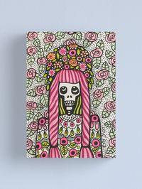 "Celebration Day" by Ray Dust. Original pen and ink artwork of my Day of the Dead skeleton lady printed on many different products in my Redbubble shop. She is wearing a decorative outfit and hairstyle inspired by Frida Kahlo. Bright colors, colourful, detailed, fineart, for the home, face, portrait, women, girl, happy, beautiful, whimsical, floral, wedding, gift, birthday, cute, seasonal art, pretty in pink, ragdoll, hairstyle, decorative, drawing, roses, stripes, skull, celebrate, canvas print