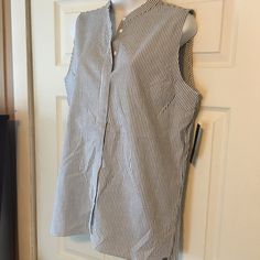 Beautifully Detailed Tahari Pinstripe Sleeveless Tunic. Size M. Breast Darts And Inverted Pleat In The Back. Very Flattering. 27 1/2” Long In Front And 29” Long In Back. 21” Armpit To Armpit. Great Summer Too And Could Also Be Worn With Cardigans In Cooler Weather. White Sleeveless Top With Vertical Stripes, Sleeveless Pinstripe Tops For Summer, Sleeveless Striped Spring Blouse, Sleeveless Striped Blouse For Spring, Spring Striped Sleeveless Blouse, Pinstripe Sleeveless Top For Spring, Pinstripe Top For Summer Daywear, Casual Sleeveless Vertical Stripes Tank Top, Casual Sleeveless Top With Vertical Stripes