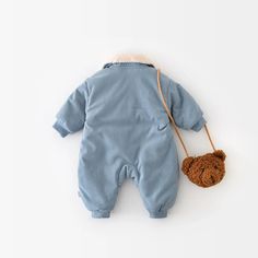 Introducing the Corduroy Fur Turn Down Romper—the perfect winter outfit for your little one! Made from soft and cozy cotton, this romper is designed to keep your baby warm and comfortable during the colder months. With its adorable animal pattern and stylish turn-down collar, it's perfect for both baby boys and girls. The single-breasted closure makes dressing a breeze, while the long sleeves provide extra warmth. Available in a charming blue color, this romper is as cute as it is functional. Ge Winter Cotton Onesie, Blue Long Sleeve Jumpsuits And Rompers For Playtime, Winter Cotton Bubble Romper With Long Sleeves, Winter Cotton Bubble Romper For Playtime, Winter Long Sleeve Bubble Romper For Playtime, Cotton Bubble Romper For Winter Playtime, Winter Long Sleeve Cotton Bubble Romper, Cute Blue Winter Onesie, Cute Blue Long Sleeve Jumpsuits And Rompers