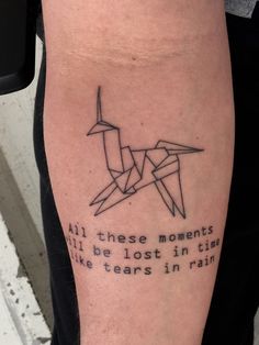 a person with a tattoo on their arm that says, all these moments will be lost in time like tears in rain