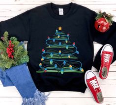 If you're a book lover, this is the shirt for you! This christmas gift features a festive tree with books sticking out of it. The shirt is made from soft and comfortable fabric, perfect for wearing all day long. It's also a great way to show your support for the library community during the holiday season. So whether you're looking for a unique Christmas gift or just want to add some extra warmth to your wardrobe, consider purchasing this shirt today. * S I Z I N G * ✺ Sizing is unisex  ✺ For adults, size runs like men's, though not overly large. Most women find their typical size works best, since they are meant to fit a touch loose and go up 1 or 2 sizes if you want the oversized look. ✺ Size guide and fit:  The size chart is listed in photos above.  Please use the measurement for the mo Little Sister Gifts, Book Tree, Tree Sweater, Teacher Librarian, Book Shirt, Unique Christmas Gift, Christmas Book, Make Her Smile, Book Shirts