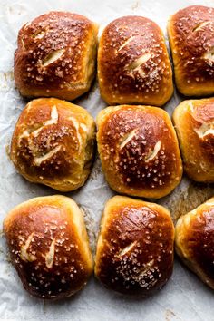 freshly baked bread rolls with sesame seeds on top