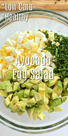 the ingredients for avocado egg salad in a glass bowl