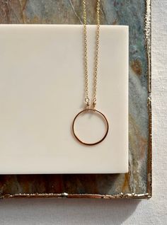 The simple circle necklace can be worn on its own or layered with your favorite pieces. Available in both sterling silver and 14k gold fill. The circle pendant measures approximately 1 inch or 20mm in diameter.  This piece coordinates well with so many other pieces in my shop! Minimalist Hypoallergenic Round Jewelry, Rose Gold Round Disc Necklace For Everyday, Dainty Everyday Round Necklaces, Everyday Circular 14k Gold Filled Jewelry, Everyday 14k Gold Filled Circular Jewelry, Everyday Rose Gold Round Disc Necklace, Everyday Rose Gold Circle Jewelry, Everyday Hypoallergenic Round Pendant Necklaces, Nickel Free Minimalist Round Jewelry