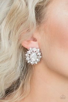 Varying in size, glittery white rhinestones and ornate silver accents burst from a dramatic white gem center for a stellar look. Earring attaches to a standard post fitting. Sold as one pair of post earrings. P5PO-WTXX-136XX Anniversary Crystal Clip-on Jewelry, Elegant Crystal Jeweled Earrings For Wedding, Elegant Wedding Crystal Earrings, Wedding Costume Jewelry Earrings, Crystal Jeweled Earrings For Anniversary, Wedding Costume Jewelry Earrings With Cubic Zirconia, Wedding Costume Jewelry Earrings In Cubic Zirconia, Elegant Jeweled Earrings For Anniversary, Crystal Anniversary Earrings With Jewels