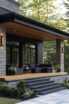 an outdoor living area with steps leading to the patio