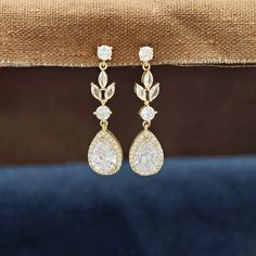 Sparkling Cubic Zirconia Floral Teardrop Earrings, a perfect accessory for the bride-to-be, bridesmaids, or anyone seeking a sophisticated touch of elegance for their special day or any occasion. These bridal earrings are designed to captivate with their high-quality cubic zirconia stones, set in a floral teardrop pattern that exudes timeless grace. ✨ Key Features: - Earring Length: Approximately 1.57 inches, making them the perfect length for a variety of hairstyles and face shapes.  - Bottom T Bridal Earrings Gold, Teardrop Pattern, Earrings For Wedding, Wedding Day Jewelry, Gold Bridal Earrings, Bride Earrings, Earrings Bridesmaid, Stunning Earrings, Wedding Earrings