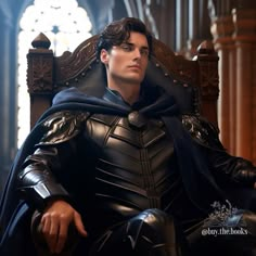 a man sitting in a chair with a cape on his head and wearing black leather armor