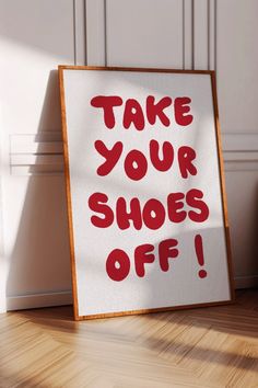 a sign that says take your shoes off