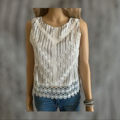 This Pretty Sleeveless Top With Eyelet Trim. This Top Has Black And White Stripes Under The Eyelet Lace. 100% Rayon Lace Vest Top For Spring, Spring Lace Sleeveless Tank Top, White Embroidered Tank Top For Spring, White Embroidered Cami Tank Top, Fitted White Tank Top With Floral Embroidery, White Fitted Tank Top With Floral Embroidery, Spring Sleeveless Crochet Top With Floral Embroidery, Floral Embroidery Sleeveless Crochet Top For Beach, Floral Embroidered Sleeveless Crochet Top For Beach