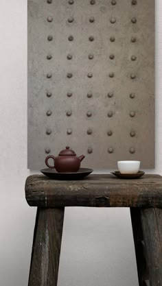 a table with a tea pot on it and a bowl sitting on top of it