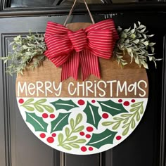 Welcome the holiday season with our 18-inch red Merry Christmas Round Door Sign. Crafted from laser-cut plywood and adorned with vibrant acrylic paints, this cheerful sign is the perfect way to spread holiday cheer. Hang it on your front door or in your home to add a festive touch. With its Cricut stencil material, the design is flawlessly precise. Embrace the spirit of Christmas with this eye-catching door sign Front Door Signs Diy Painted Wood, Happy Holiday Door Hangers, Round Wooden Christmas Signs Diy, Christmas Door Signs Diy, Christmas Door Hangers Wooden Diy, Round Door Hanger Ideas, Round Wooden Door Hangers Diy, Winter Door Signs, Diy Christmas Door Hangers