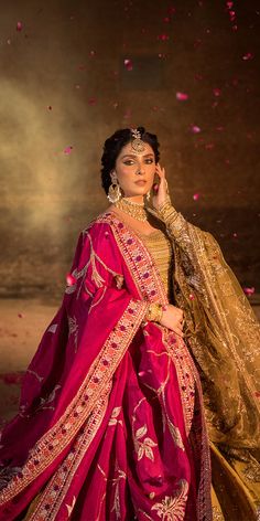 a woman in a red and gold outfit