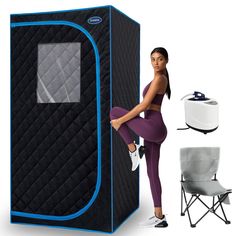 a woman standing next to an inflatable portable shower with the door open and chair beside it