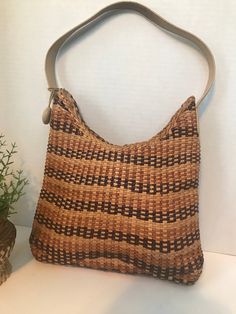 "Vintage Monsac Original handbag, Monsac leather purse, Monsac woven leather handbag purse, Vintage woven leather purse, Vintage summer purse.  The inside top of the strap does show some wear.  This is a perfect summer bag/purse with 3 tones of brown leather woven together to form a weave pattern. Height 11\" Width 12\" Shoulder strap 20\"" Casual Rectangular Woven Leather Hobo Bag, Rectangular Straw Shoulder Bag With Woven Leather, Casual Woven Leather Hobo Bag In Satchel Shape, Casual Hobo Satchel Bag In Woven Leather, Casual Woven Leather Hobo Satchel Bag, Rectangular Woven Leather Straw Shoulder Bag, Casual Brown Woven Leather Hobo Bag, Square Woven Bags For Daily Use, Handheld Handwoven Straw Bag For Everyday Use