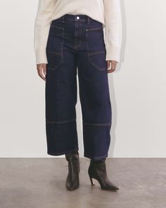 The Way-High® Gardener Cropped Jean is a wide-leg workwear-inspired jean that plays big into utilitarian style. Designed with a high-rise silhouette, it has extra-large functional pockets—both front and back, utility style stitching, a zipper fly, and a slightly cropped length. It’s made with organic cotton denim that has a heavier workwear handfeel. Wide Leg Flare Jeans With Patch Pockets For Fall, Utility Wide-leg Denim Jeans, Fall Wide Leg Flare Jeans With Side Pockets, Utility Style Wide Leg Flare Jeans With Patch Pockets, Dark Wash Flare Jeans With Contrast Stitching For Work, High Waist Cargo Jeans With Patch Pockets For Work, Wide-leg Cargo Jeans For Workwear, Utility Wide-leg Workwear Jeans, Fall Cargo-style Wide-leg Jeans