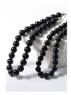 Experience the bold and versatile beauty of our 14mm Black Onyx Beaded Necklace with OT Buckle. This uniquely crafted necklace features large black onyx beads and an OT clasp, creating a statement piece that effortlessly combines boldness with contemporary style. Metal: Recycled Sterling Silver Plated On Brass Gemstone: Black onyx 14mm Length: 420mm Weight: 105g Buckle Necklace, Edison Pearls, Gemstone Beaded Necklace, Onyx Bead, Tiger Eye Stone, Recycled Sterling Silver, Brass Material, Ring Bracelet, Stone Necklace