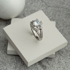 A wonderful ring to accompany you on your special days. Also great as a gift to your loved ones. We wrap it beautifully as a gift wrap for you. 💎 9 mm cubic zircone, 6 pieces of small baguette zircon,  it is decorated with 6 round zircon stones and 24 small zircon stones 💎 Big Zircon Silver Ring it will add sparkle to your glow. 💎 It is decorated with one large zircon stone with a hexagon shape of 9 mm in size and small zircon stones around it. 💎 It is specially made according to your finger Dazzling Cubic Zirconia Birthstone Ring As Gift, Diamond White Sapphire Ring With Center Stone For Gift, White Sapphire Ring With Center Stone As Gift, Diamond White Cubic Zirconia Crystal Ring Gift, Diamond Crystal Ring With Center Stone As Gift, Dazzling Diamond White Sapphire Ring Gift, Classic Cubic Zirconia Birthstone Ring, Cubic Zirconia Cluster Ring With Prong Setting As Gift, Formal Cubic Zirconia Birthstone Ring With Accent Stones