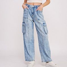 Step into the urban-chic vibe with our High Waist Baggy Denim Cargo Trousers, perfectly blending style and functionality. These jogger-style trousers are tailored to a flattering high-waist fit, designed to elongate your silhouette while providing comfort with an elastic waist. Featuring a multitude of pockets — hip, back, and side knee cargo — they offer ample storage for your essentials. The straight-leg cut maintains a sleek profile, and the combination of button and zippered closures ensures Trendy Mid-rise Jeans For Elevated Casual Occasions, Trendy Mid-rise Jeans For Elevated Casual, High-waisted Denim Pants For Streetwear, High-waisted Denim Bottoms For Streetwear, Spring Cargo Jeans With Multiple Pockets In Medium Wash, Spring Streetwear Cargo Jeans With Tapered Leg, Trendy High Rise Light Wash Cargo Jeans, Trendy High Rise Baggy Cropped Jeans, Urban High-rise Light Wash Cargo Jeans