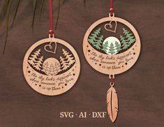 two wooden ornaments hanging from a tree with the words svg at dxf