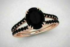 a black diamond engagement ring set in rose gold