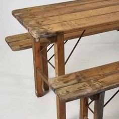 two wooden benches sitting next to each other