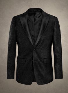 Revel in the perfect blend of style and comfort with our Italian Dolcezza Tuxedo Blazer. Expertly crafted from luxurious polyester fabric, this blazer shines in a bold black hue. Its meticulously tailored design features unique details that seamlessly add sophistication to any outfit. Perfect for making a statement, whether you're attending a glamorous gala or enhancing your everyday attire, this blazer will elevate your look effortlessly.  An elusive unique piece from our Red Carpet Collection.   Look features a 2 button tuxedo jacket with black cherry satin wide peak lapel, matching satin covered buttons, single vent and three cuff buttons.  Click 'Customize Now' to modify the look if needed.  Jacket is fully lined.  Lining: Viscose.     We have sourced stocks from the finest reputed mil Master Tailor, Pattern Weights, Tuxedo Blazer, Peak Lapel, Tuxedo Jacket, Tailored Design, Black Cherry, Custom Tailoring, Bold Black