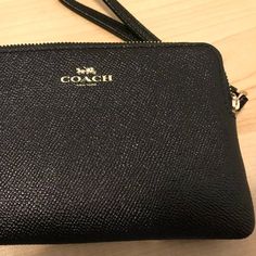 Coach Brand Wallet Clutch New With Tags Leather Coach Purse Wristlet Wallet Approx 6 3/8" X 4" X .5" Black Pebble Pattern On The Outside Black Fabric Inside 1 Main Compartments With 1 Tiny Side Compartments Coach Elegant Wallet With Cell Phone Pocket, Elegant Coach Wallet With Cell Phone Pocket, Coach Formal Pouch Wallet, Coach Clutch Wallet, Coach Evening Clutch Wallet, Formal Clutch Wristlet With Zipper Closure, Classic Formal Wristlet With Zipper Closure, Formal Wristlet With Zipper Pouch, Elegant Coach Coin Purse With Zipper