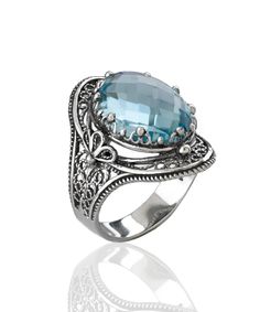 This gorgeous handmade filigree art statement ring will draw all the right kind of attention. Made of sterling silver, it is oxidized and highly polished. The ring face is 0.97" / 24.70 mm X 0.65" / 16.50 mm. Its elegant minimal design is a perfect accessory to any outfit, making this anniversary gift or birthday gift the best option for everyday wear. Sizes from 5 to 12.5 with half sizes. A stunning ring for any occasion. Comes with a gift box, velvet pouch, silver polish cloth and care card to Birthday Gemstones, The Ring Face, Art Statement, Blue Stone Ring, Silver Polish, Blue Topaz Gemstone, Statement Art, Statement Ring Silver, Sterling Silver Filigree